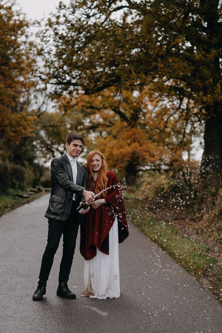champagne popping during elopement in Scotland