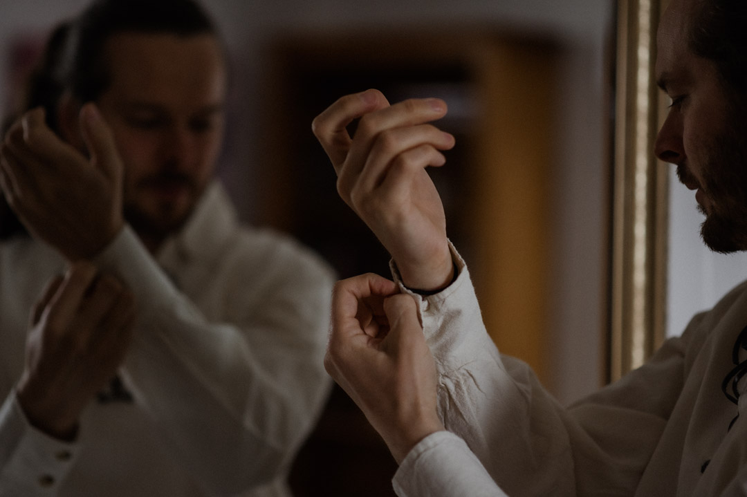 Isle of Mull groom getting ready in cottage