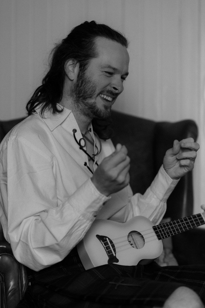 Isle of Mull elopement couple playing guitar together