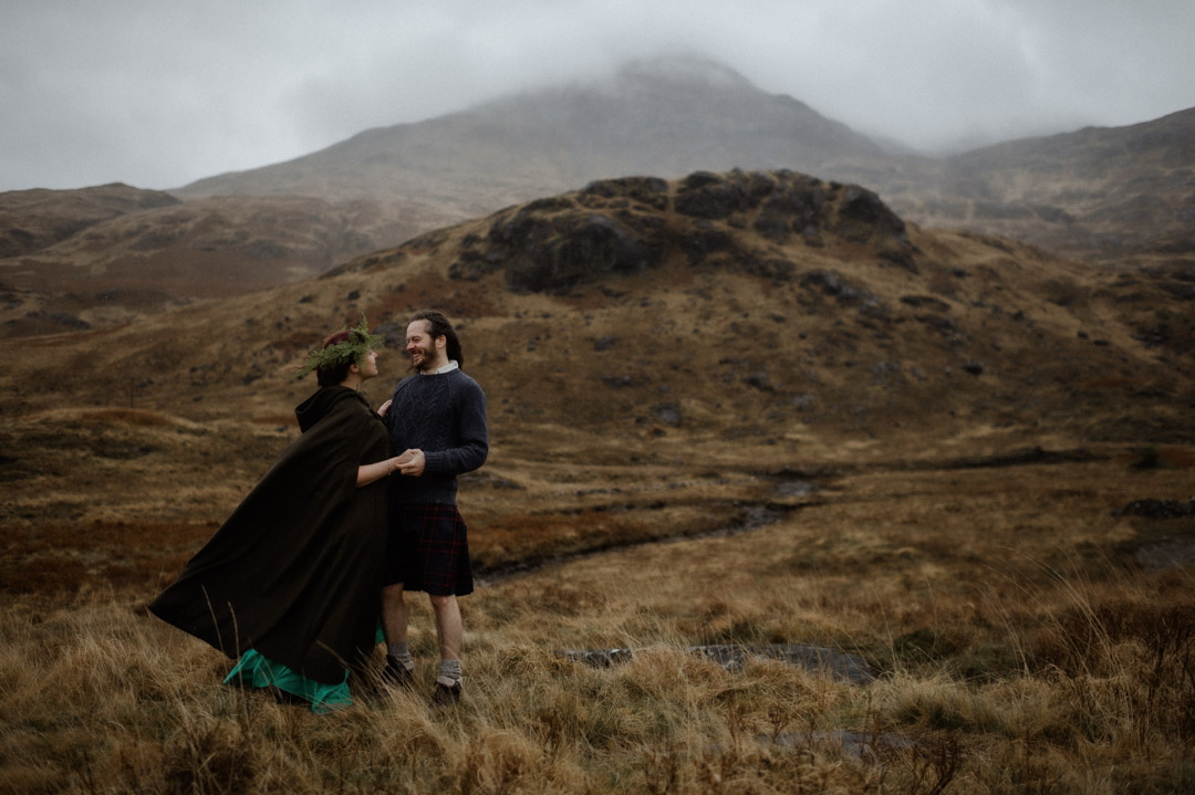 Wet elopement couple on Isle of Mull in the hills