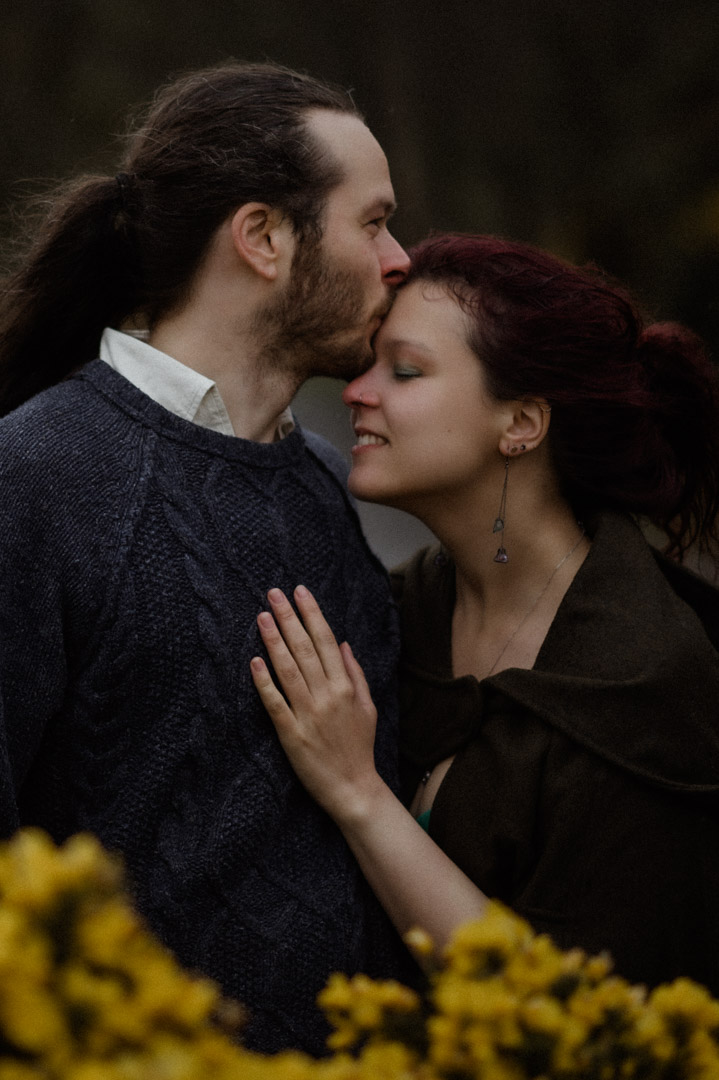 Wet elopement couple on Isle of Mull at the bay