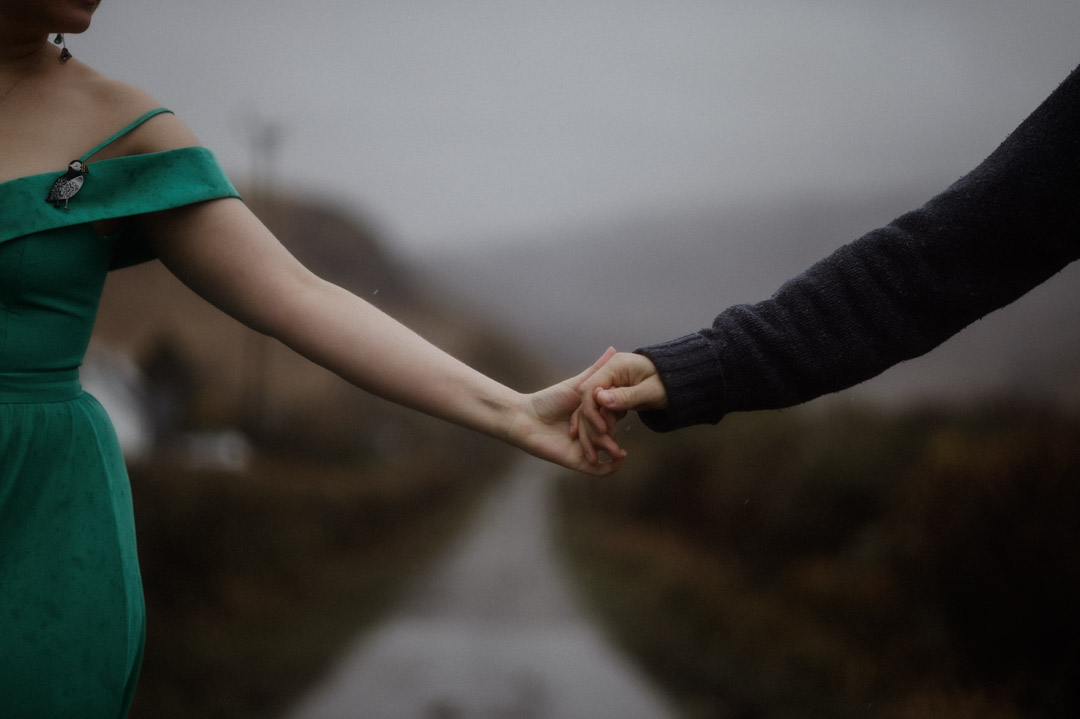 Inner Hebrides elopement couple dancing in the rain - hands