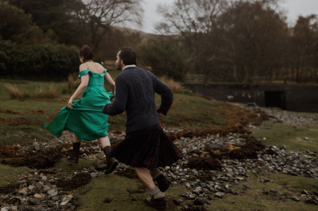 Inner Hebrides elopement couple running in the rain