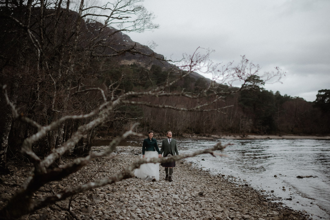 Couple by loch at elopement in the Scottish Highlands, Torridon
