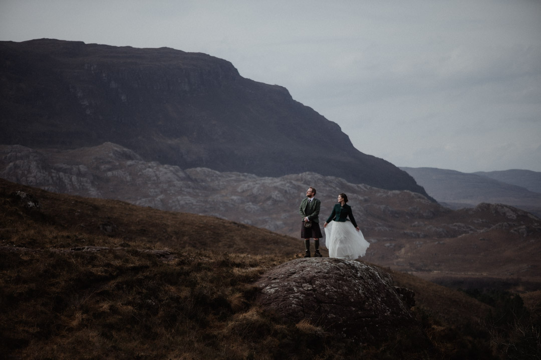 Winter elopement in Scottish hills wearing Outlander outfits and kilt, Torridon