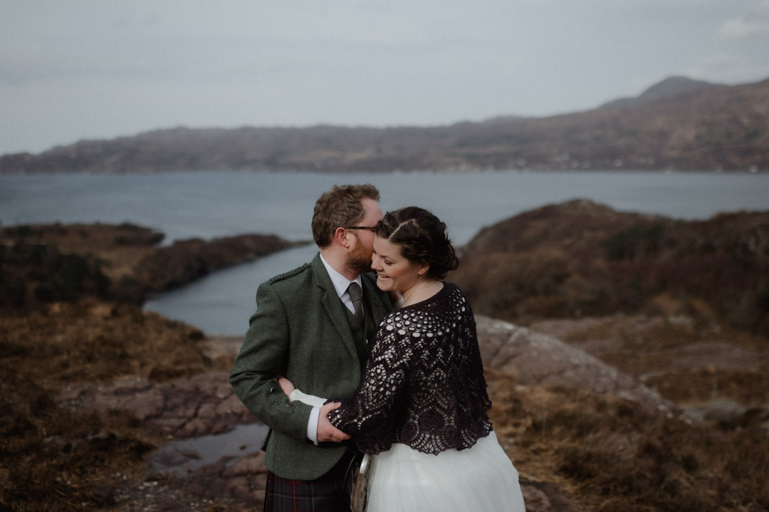 Winter elopement in Scottish hills wearing Outlander outfits and kilt