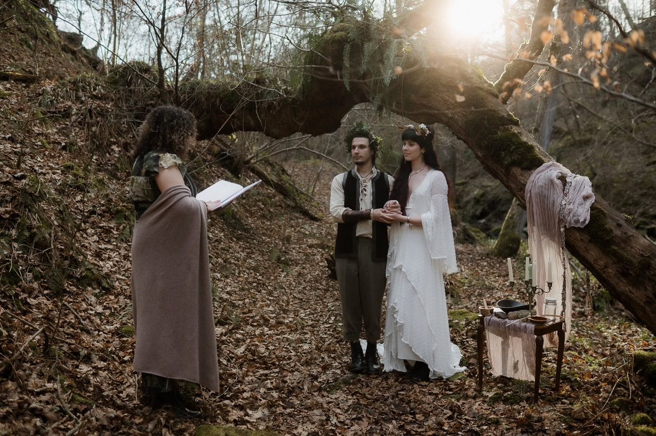 romantic elemental Beltane moment - bride and groom during pagan ceremony
